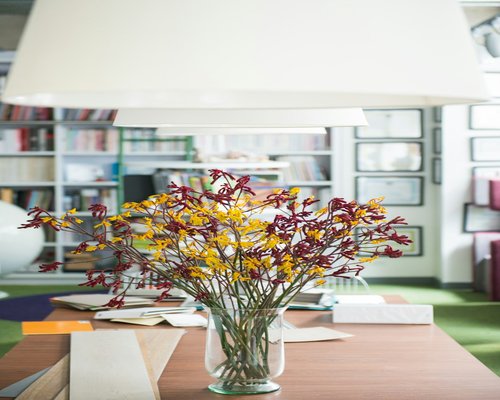 A transparent, beautifully organized corporate mailbox area inside a clean office in Bogota