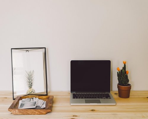 Organized clean office desk setup with appropriate screen distance and gentle lighting accents